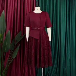 Elegant burgundy lace patchwork fake two-piece dress displayed on a studio mannequin.