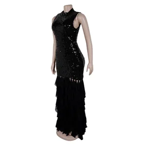 Close-up of elegant black sleeveless evening dress with sequin and ruffled mesh details