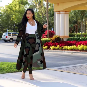 Woman in outdoor setting wearing a camouflage print long cardigan and matching leggings