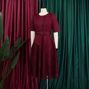 Elegant burgundy lace patchwork faux two-piece dress with belt displayed on mannequin