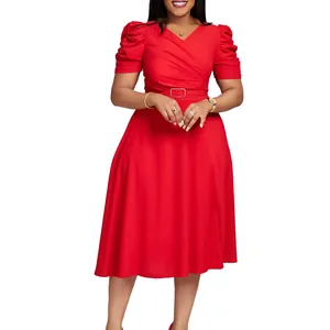 Detail view of red puff sleeve V-neck midi dress with waist belt and pleated bodice