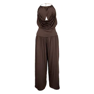 Elegant brown halter neck pleated top and wide-leg trousers set displayed on mannequin