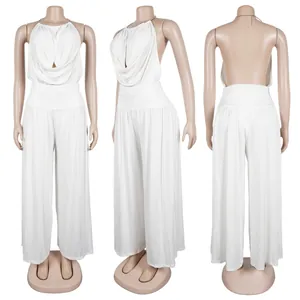 Detail view of white halter draped top and wide-leg pants set on mannequin