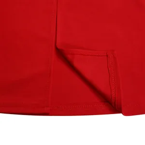 Close-up of high-quality stitching and hem detail on a vibrant red summer dress.