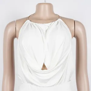 Close-up detail of elegant white halter neck pleated top with draped fabric and metal ring