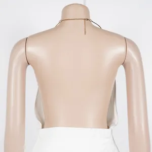 Back view detail of elegant white halter neck two-piece set with backless design