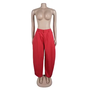 Front view of stylish red wide-leg commuter trousers on a mannequin
