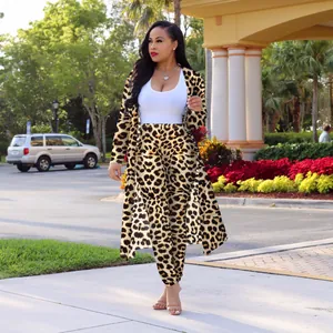 Full-body view of a stylish leopard print long cardigan and matching pants set outdoor