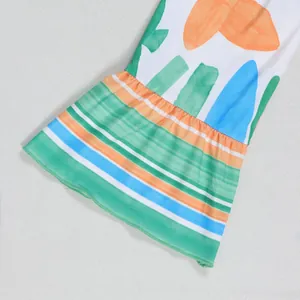 Detailed close-up showing the flared ruffled cuff of a colorful floral print summer dress