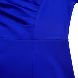 Macro detail of high-quality stitching and pleated texture on an elegant blue dress