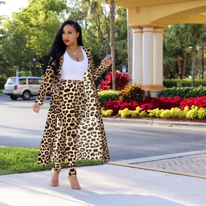 Full view of women's leopard print long sleeve cardigan and pants set in outdoor setting