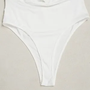 Macro detail showing the high-cut white fabric and neat stitching of this bodysuit