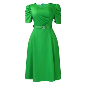 Detail view of a bright green midi dress with ruched V-neck and puff sleeves