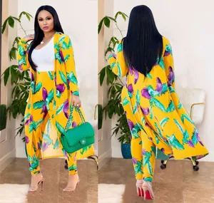 Detailed front and back view of vibrant yellow floral print cardigan and long pants two-piece set.