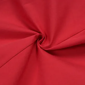 Close-up view of premium red twill fabric texture for elegant loose casual trousers