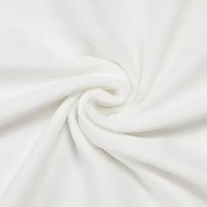 Macro detail of breathable white pleated fabric for elegant two-piece set outfit