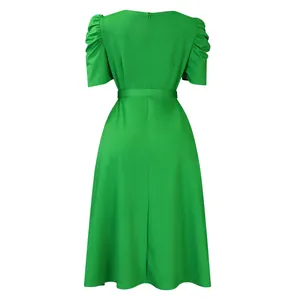 Back view of a green short-sleeved dress with pleated puff sleeves and a matching belt