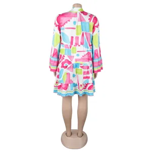 Back view of a colorful geometric floral print loose mini dress with tiered ruffled hem