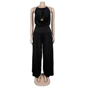 Detailed view of the pleated halter neck design and flowing wide-leg silhouette of the two-piece set