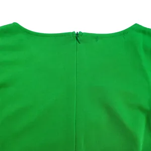 Detailed view of the high-quality back invisible zipper on this vibrant green elegant dress