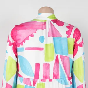 Close-up back view showing the colorful geometric watercolor print on this short dress