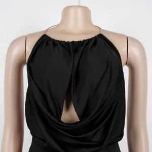 Close-up detail showing the pleated drape and metal ring of this black halter neck top