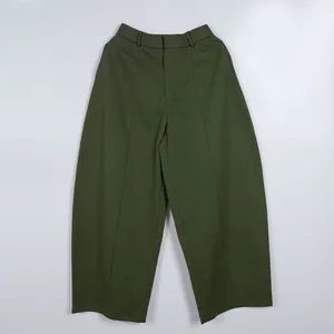 Olive green wide-leg cropped trousers with center seam detail for a loose, stylish look.