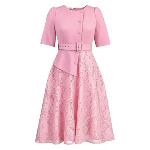 Detail view of the pink lace patchwork dress with a waist belt and puff sleeves.