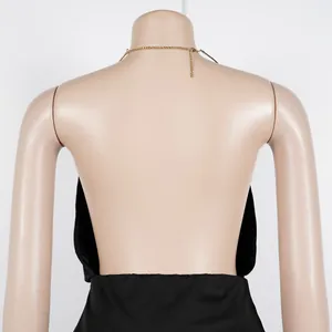 Rear view of elegant backless halter top with a delicate gold chain neck detail