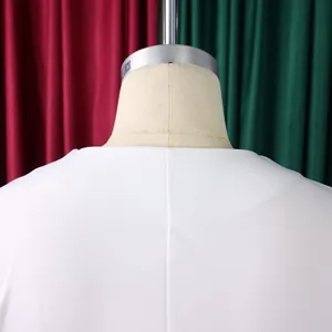 Detail of white short-sleeved top back neckline showing clean stitching and fabric.