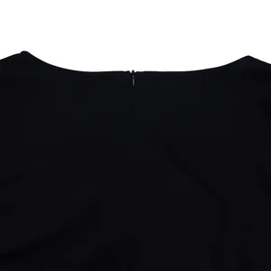 Close-up of the hidden back zipper on a sophisticated black V-neck pleated dress.