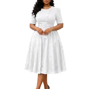 Close-up of white lace patchwork dress with high waist belt and button detailing