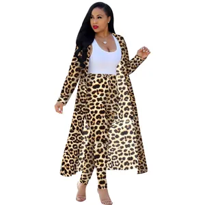 Full body view of a woman wearing a leopard print cardigan and leggings set.