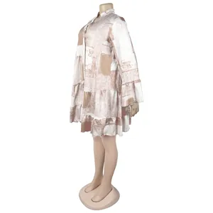 Profile view of an elegant floral print loose mini dress featuring ruffled sleeves.