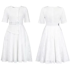 Detailed view of elegant white lace patchwork dress with high waist and matching belt