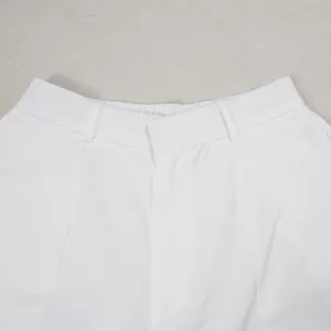 Detailed view of white commuter casual trousers waistband with elastic back and belt loops