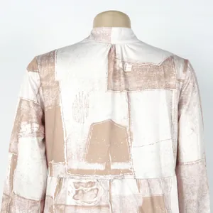 Detailed back view of a loose floral print dress featuring elegant abstract patterns
