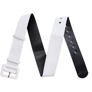 Detail shot of a wide two-tone white and black fashion belt with silver eyelets.