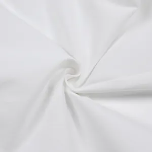 Detailed macro view showing the premium white cotton twill fabric texture and weave