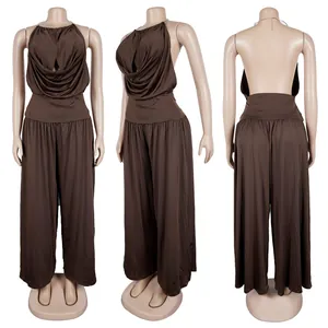 Front, side and back views of brown halter neck pleated top and wide-leg pants