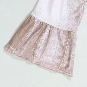 Close-up view of the ruffled bell sleeve hem on a vintage floral print mini dress