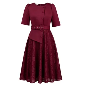Close-up detail showing the burgundy lace patchwork and belted waist of this elegant dress