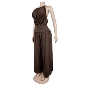 Detail of elegant brown halter neck pleated top and wide-leg trousers outfit set