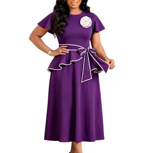 Detailed view of elegant purple midi dress featuring white rose corsage and peplum tie waist