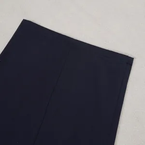 Detailed close-up of navy blue commuter casual pants showing hem and seam quality