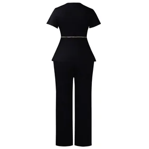 Back view of elegant black peplum top and trousers set with gold chain belt detail