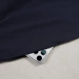 Detail shot showing the premium navy blue fabric texture of the wide-leg trousers