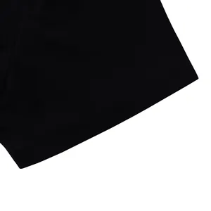 Close-up detail of the hem and fine stitching on a black short-sleeve casual top