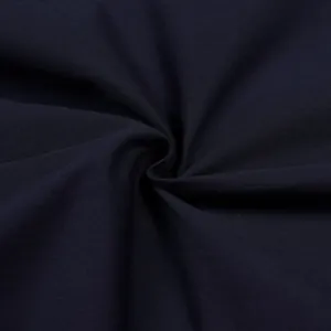 Close-up macro view of high-quality navy blue woven fabric for casual loose-fit trousers