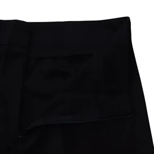 Close-up view of the concealed zipper and waistband on black casual women's trousers